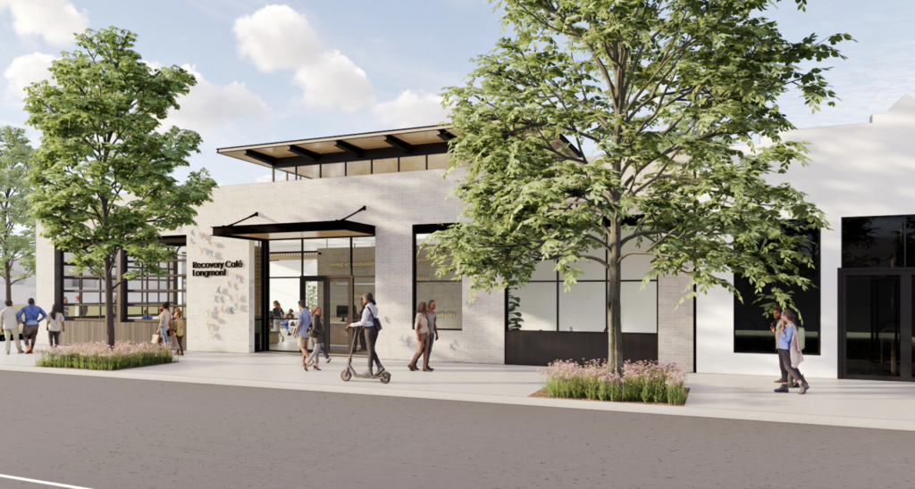 Exterior architectural rendering of Recovery Café Longmont’s future home at 801 Main Street, showing a welcoming brick building with large front windows and a bright, open entrance.