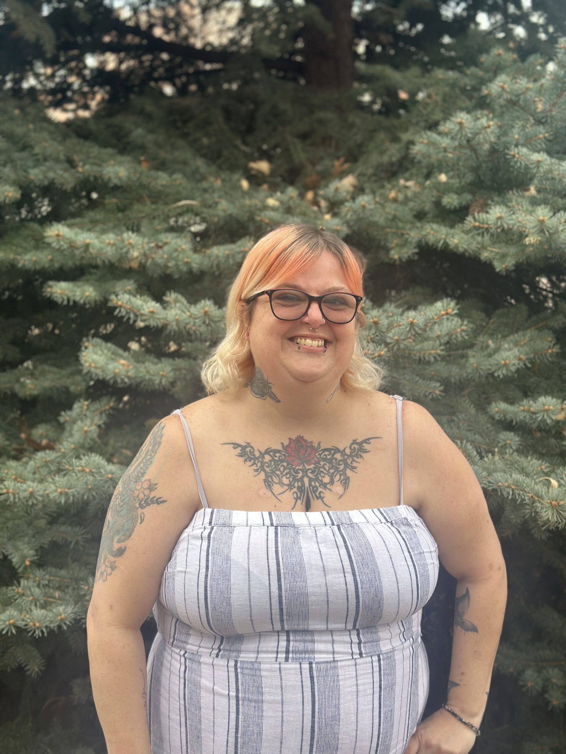 Café member Sara smiles and celebrates the love and belonging she's found in the Café community.